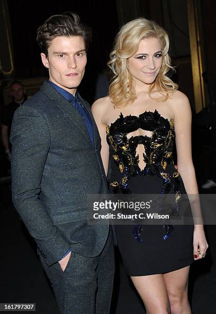 Oliver Cheshire and Pixie Lott attend the Julien Macdonald show during London Fashion Week Fall/Winter 2013/14 at Goldsmiths' Hall on February 16,...