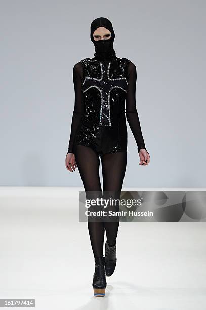 Model walks the runway at the Dans La Vie show during London Fashion Week Fall/Winter 2013/14 at Freemasons Hall on February 16, 2013 in London,...