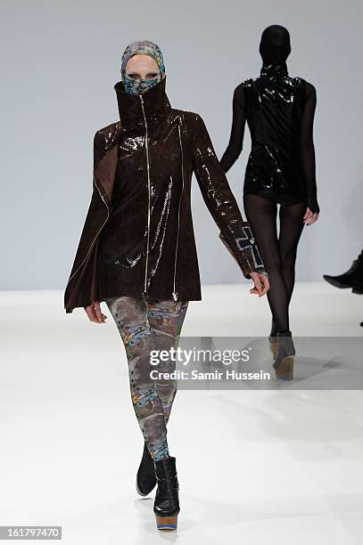 Model walks the runway at the Dans La Vie show during London Fashion Week Fall/Winter 2013/14 at Freemasons Hall on February 16, 2013 in London,...