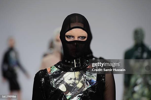 Model walks the runway at the Dans La Vie show during London Fashion Week Fall/Winter 2013/14 at Freemasons Hall on February 16, 2013 in London,...