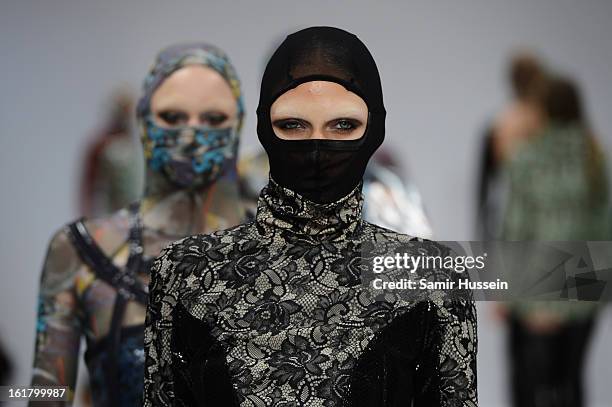 Model walks the runway at the Dans La Vie show during London Fashion Week Fall/Winter 2013/14 at Freemasons Hall on February 16, 2013 in London,...