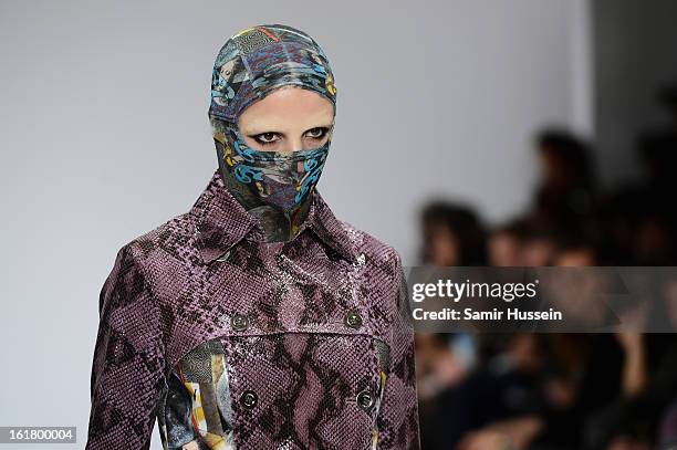 Model walks the runway at the Dans La Vie show during London Fashion Week Fall/Winter 2013/14 at Freemasons Hall on February 16, 2013 in London,...