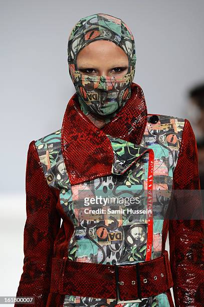 Model walks the runway at the Dans La Vie show during London Fashion Week Fall/Winter 2013/14 at Freemasons Hall on February 16, 2013 in London,...