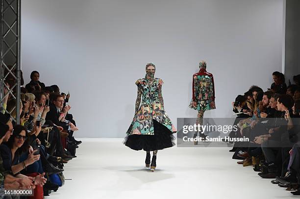 Model walks the runway at the Dans La Vie show during London Fashion Week Fall/Winter 2013/14 at Freemasons Hall on February 16, 2013 in London,...