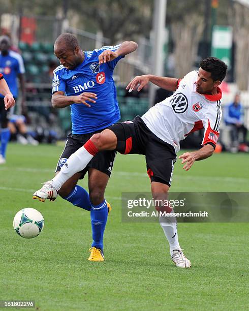 Midfielder Collen Warner of the Montreal Impact battles midfielder Marcelo Saragosa of DC United February 16, 2013 in the third round of the Disney...