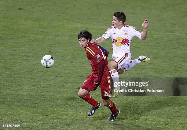 John Stertzer of Real Salt Lake attempts to control the ball pressured by Connor Lade of the New York Red Bulls during the first half of the FC...