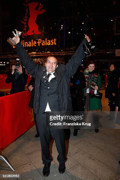 Nazif Mujic holds the Silver Bear for the best actor at the Closing Ceremony Red Carpet Arrivals - BMW At The 63rd Berlinale International Film...