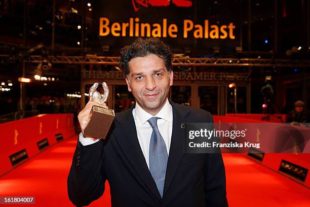 Danis Tanovic holds the Silver Bear for the Jury Grand Prix at the Closing Ceremony Red Carpet Arrivals - BMW At The 63rd Berlinale International...