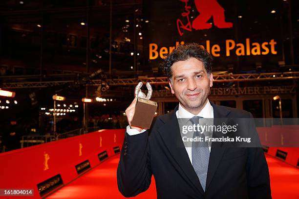 Danis Tanovic holds the Silver Bear for the Jury Grand Prix at the Closing Ceremony Red Carpet Arrivals - BMW At The 63rd Berlinale International...