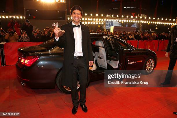 Aziz Zhambakiyev holds the Silver Bear for an outstanding artistic achievement at the Closing Ceremony Red Carpet Arrivals - BMW At The 63rd...