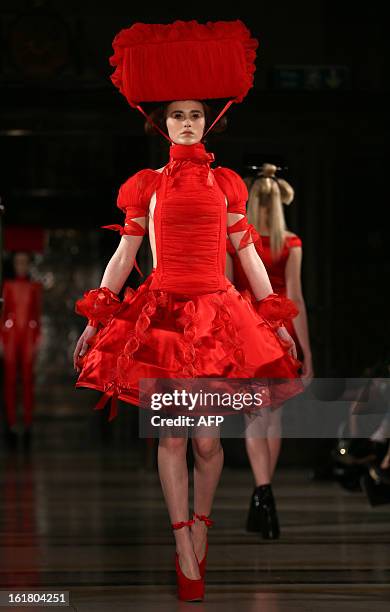 Model presents a creation by Pam Hogg during the 2013 Autumn/Winter London Fashion Week in London on February 16, 2013. AFP PHOTO/ANDREW COWIE