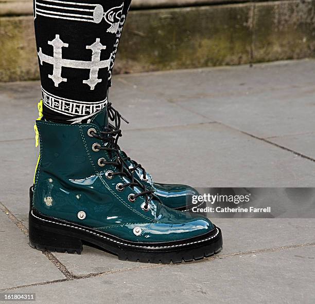 Traits Kenzo Boots,Opening Ceremony label and KTZ leggings worn by B.Traits, Radio 1 Presenter at London Fashion Weekat London Fashion Week...