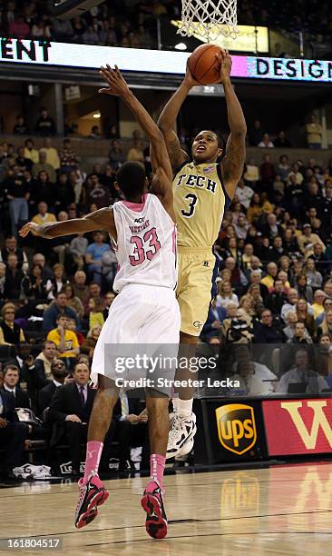 Marcus Georges-Hunt of the Georgia Tech Yellow Jackets drives to the basket against Aaron Rountree III of the Wake Forest Demon Deacons during their...