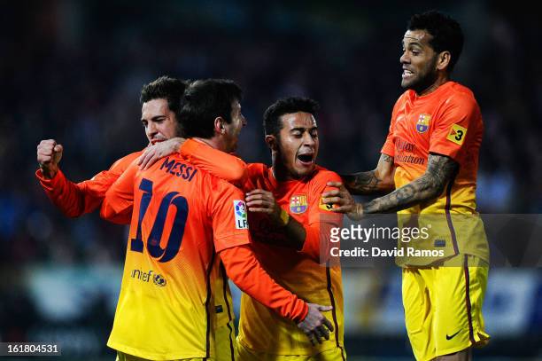 Lionel Messi of FC Barcelona celebrates with his team-mates after scoring his team's second goal during the La Liga match between Granada CF and FC...