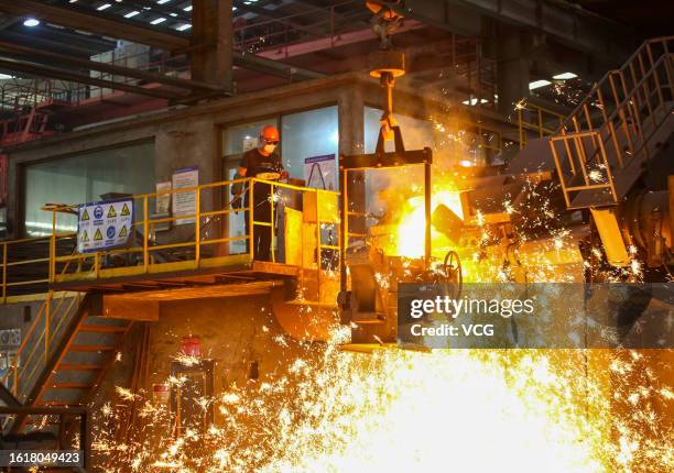 Worker braves scorching heat to manufacture hydraulic valve at the workshop of Nantong Huadong Hydraulic Technology Co., Ltd. On August 16, 2023 in...