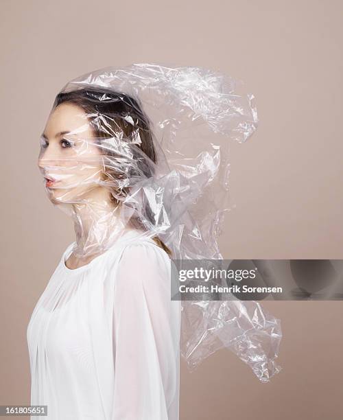 woman wrapped in plastic - suffocated stock-fotos und bilder
