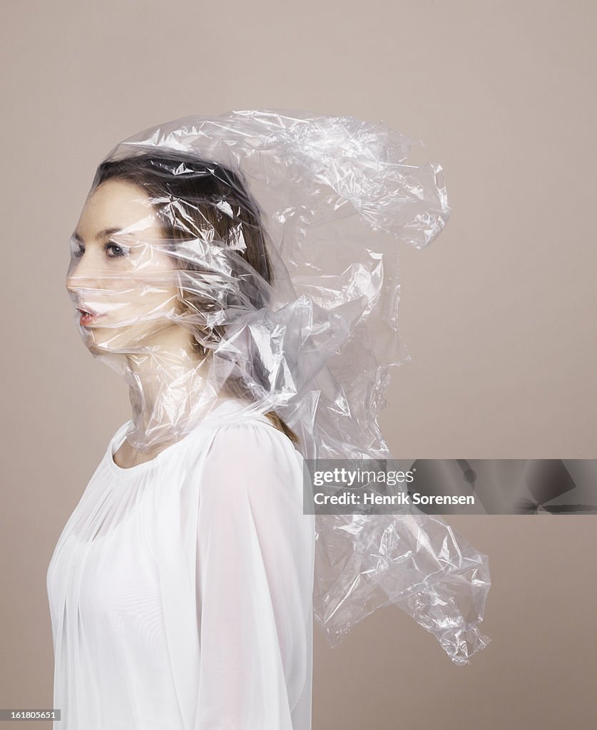 Woman wrapped in plastic