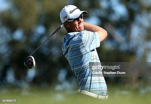 John Senden of Australia hits his tee shot on the ninth hole during the final round of the Farmers Insurance Open on the South Course at Torrey Pines...