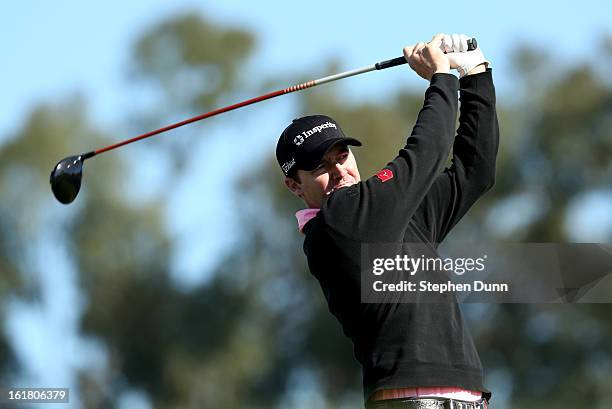 Jimmy Walker hits his tee shot on the ninth hole during the final round of the Farmers Insurance Open on the South Course at Torrey Pines Golf Course...