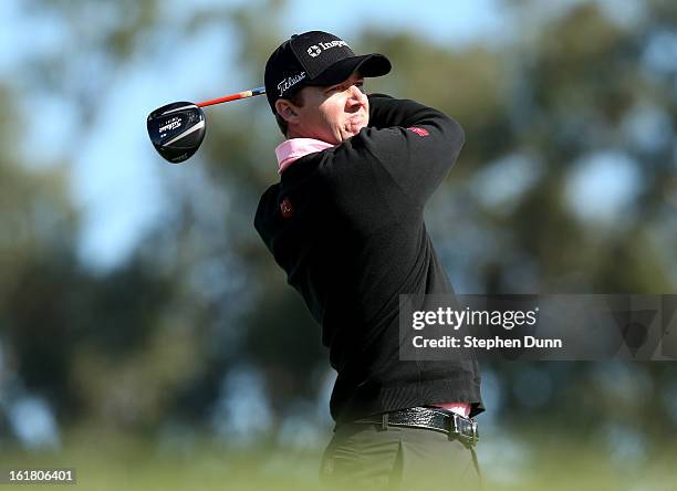 Jimmy Walker hits his tee shot on the ninth hole during the final round of the Farmers Insurance Open on the South Course at Torrey Pines Golf Course...