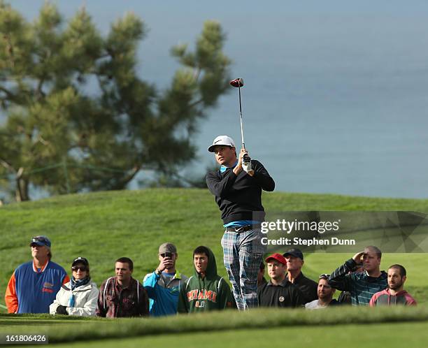 Nick Watney hits his tee shot on the second hole during the final round of the Farmers Insurance Open on the South Course at Torrey Pines Golf Course...
