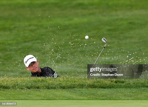 Chez Reavie hits out of a bunker on the second hole during the final round of the Farmers Insurance Open on the South Course at Torrey Pines Golf...