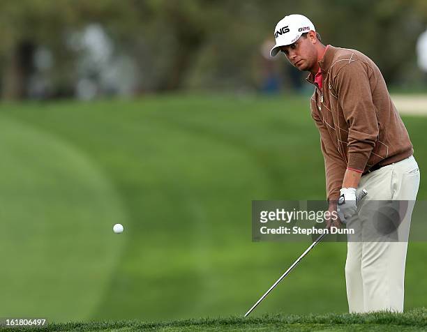 Harris English chips on the second hole during the final round of the Farmers Insurance Open on the South Course at Torrey Pines Golf Course on...