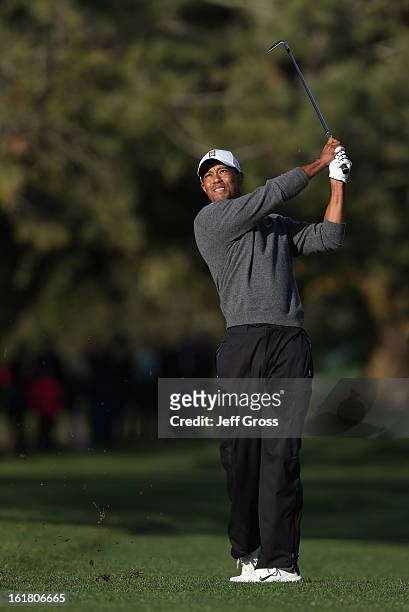 Tiger Woods hits his second shot on the second hole during the final round of the Farmers Insurance Open at at Torrey Pines South Golf Course on...