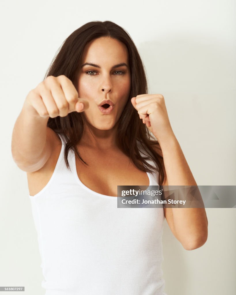 Potrait of girl punching towards the camera