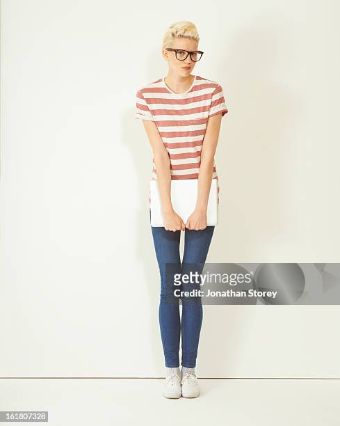 female wearing glasses holding laptop - laptop studio shot stock pictures, royalty-free photos & images