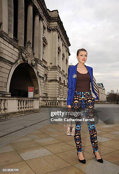 Romanian lifestyle blogger Juilana Butnariu wears and electric blue monchrome Benshka single breasted jacket, Mango top, ASOS slim printed cigarette...