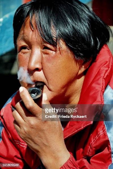 Pipe smoking woman in Greenland's Kulusuk