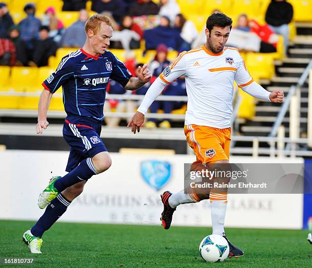 Will Bruin of the Houston Dynamo battles for the ball against Jeff Larentowicz of the Chicago Fire during the first half of their game in the...