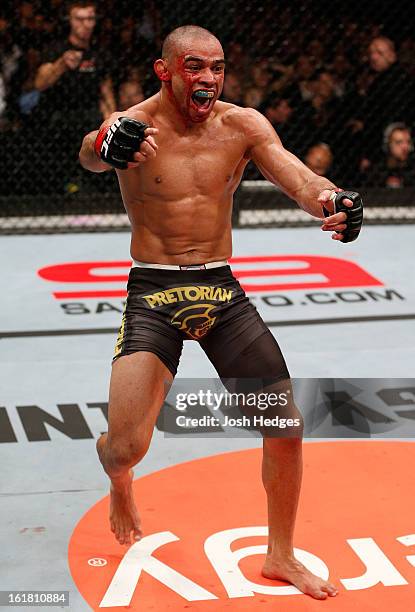 Renan Barao reacts after defeating Michael McDonald in their interim bantamweight title fight during the UFC on Fuel TV event on February 16, 2013 at...