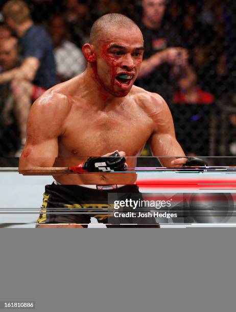 Renan Barao reacts after defeating Michael McDonald in their interim bantamweight title fight during the UFC on Fuel TV event on February 16, 2013 at...