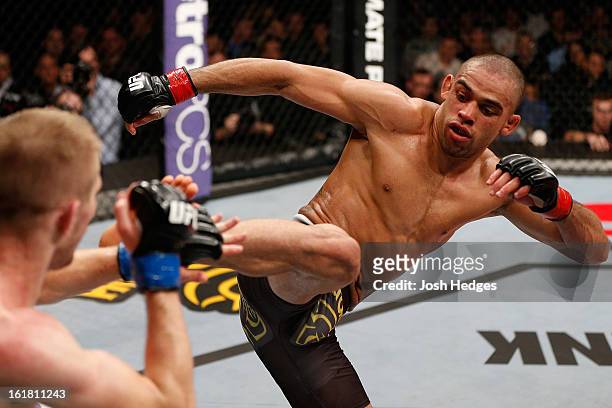 Renan Barao kicks Michael McDonald in their interim bantamweight title fight during the UFC on Fuel TV event on February 16, 2013 at Wembley Arena in...