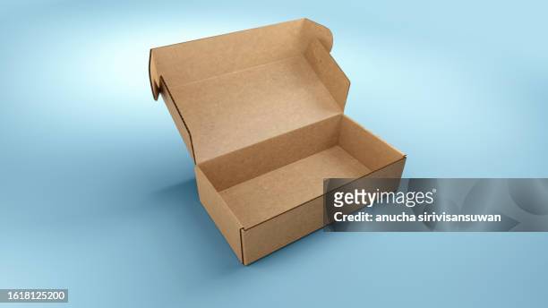 empty cardboard box on blue background - box packaging mockup foto e immagini stock