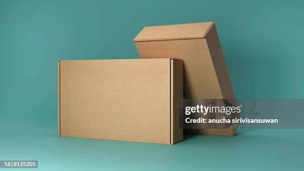 empty cardboard box on blue background - wellpapp bildbanksfoton och bilder