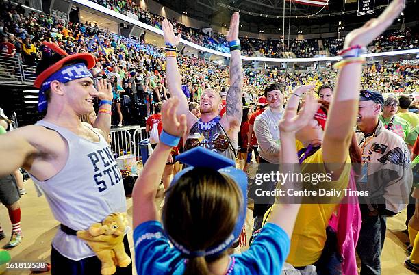 Alex Miller, Vinny Carrano, Beth Richards and Lauren Rose stretch during the Penn State IFC/Panhellenic Dance Marathon at the Bryce Events Center in...