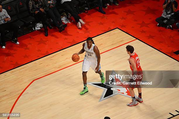 Kenneth Faried of Team Chuck dribbles the ball while looking to pass against Team Shaq during 2013 BBVA Rising Stars Challenge at Toyota Center on...