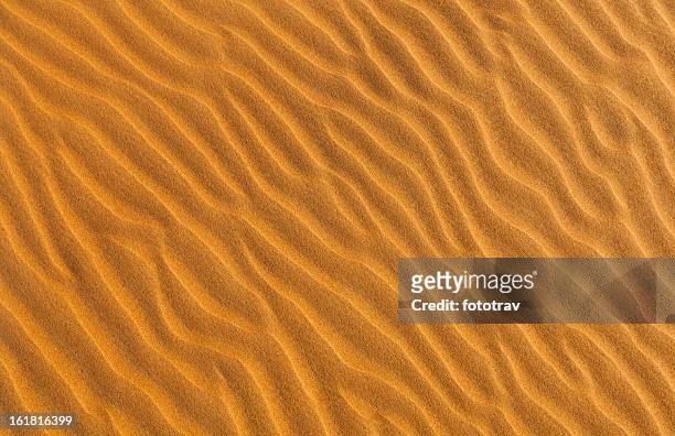 sunset on sand dunes in dubai, united arab emirates - dubai sunset desert stock pictures, royalty-free photos & images