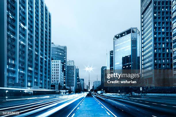 street view of paulista avenue with buildings on each side - avenida paulista stock pictures, royalty-free photos & images