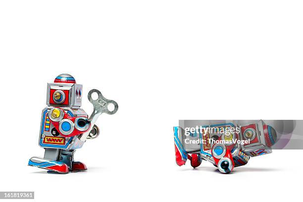 robótica robô de assistência-lata estilo retro brinquedo ajuda humor - wind up toy imagens e fotografias de stock