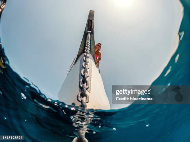 checking the anchor on a sailboat - anchor winch stock pictures, royalty-free photos & images