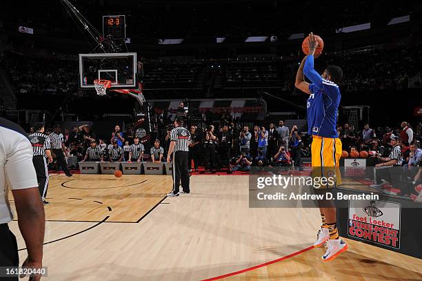 Paul George of the Indiana Pacers attempts a shot during the 2013 Foot Locker Three-Point Contest on State Farm All-Star Saturday Night as part of...