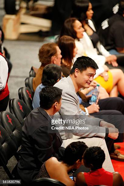 Former NBA player Yao Ming sits courtside during the Sears Shooting Stars on State Farm All-Star Saturday Night during NBA All Star Weekend on...