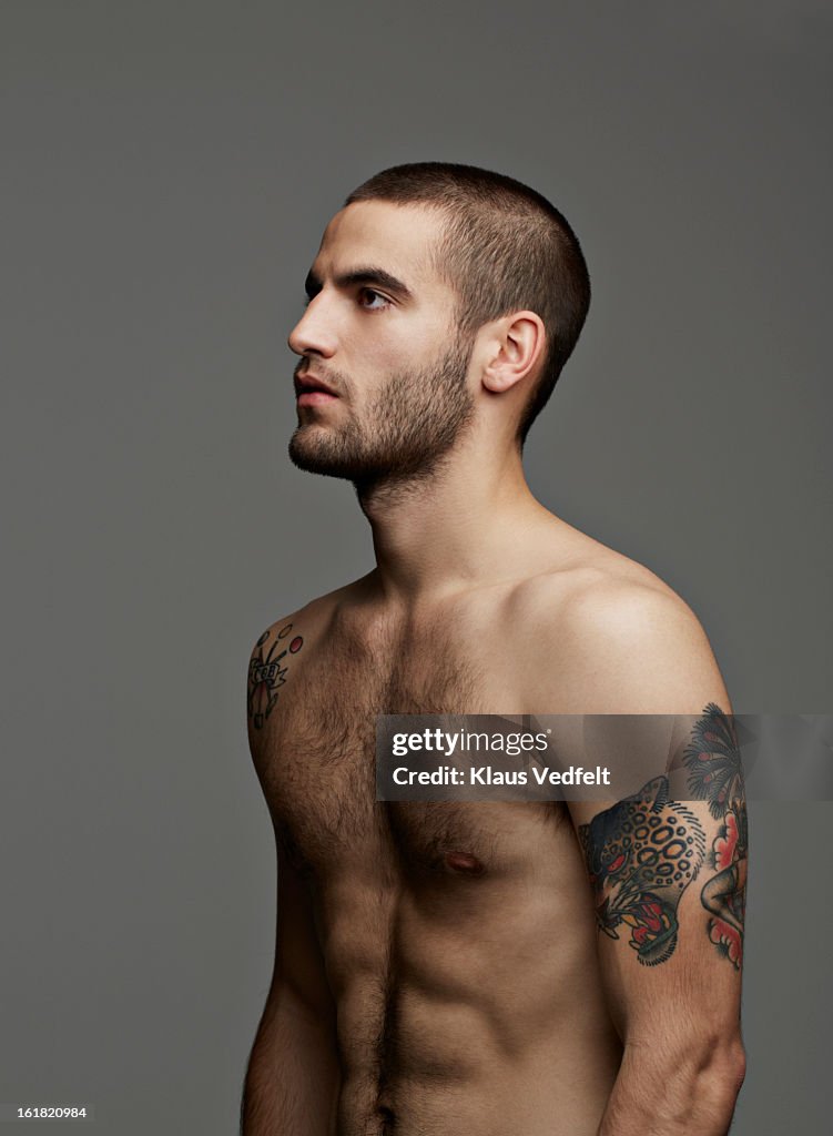 Portrait of handsome man with tatoo's