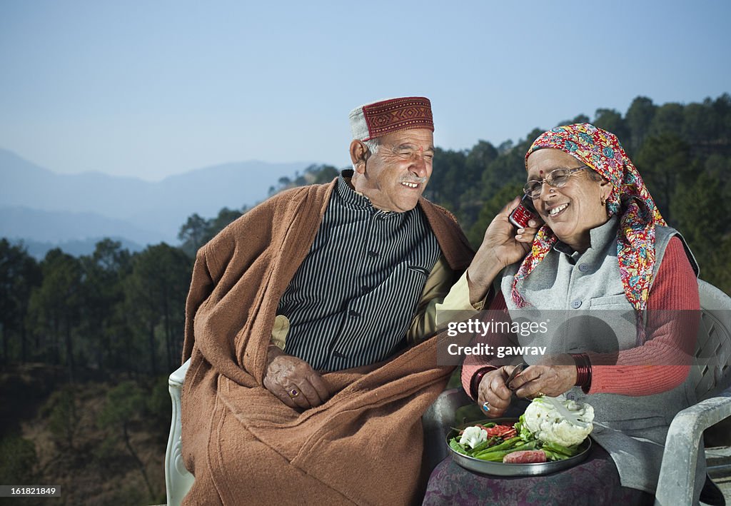 People of Himachal Pradesh: Senior couple using mobile phone