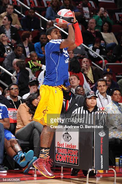 Kyrie Irving of the Cleveland Cavaliers attempts a shot during the 2013 Foot Locker Three-Point Contest on State Farm All-Star Saturday Night as part...
