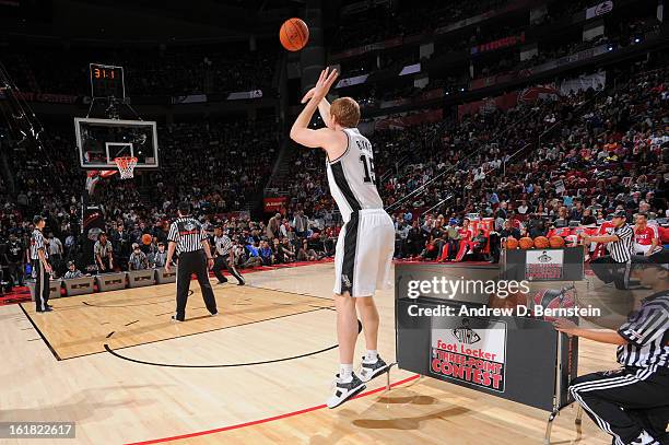 Matt Bonner of the San Antonio Spurs attempts a shot during the 2013 Foot Locker Three-Point Contest on State Farm All-Star Saturday Night as part of...